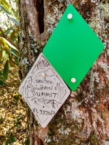 Summit Marker on Rainbow Mountain